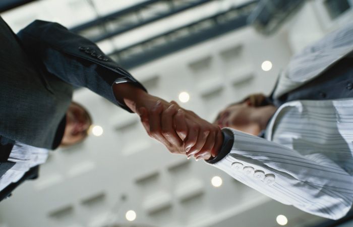 Business-Handshake-Meeting-Deal-Low-Angular-700x450.jpg